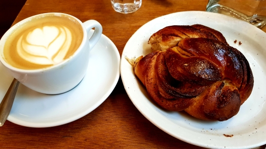 Cappuccino and Cinnamon Roll Fragments Coffee Paris France